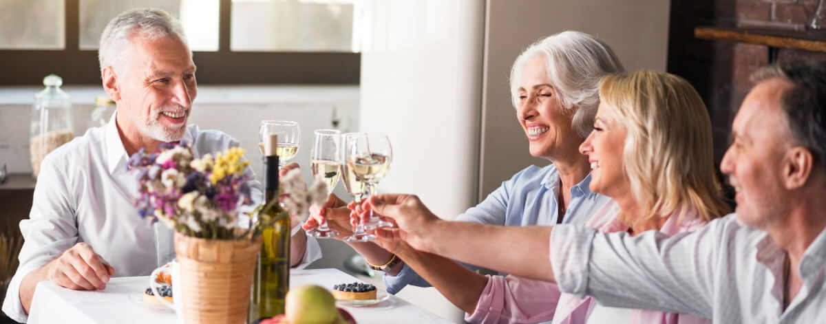 Seniors drinking wine together