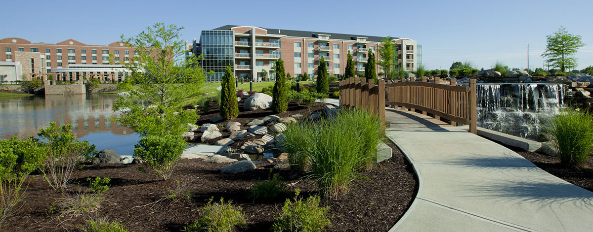 Exterior of Marquette with pond bridge