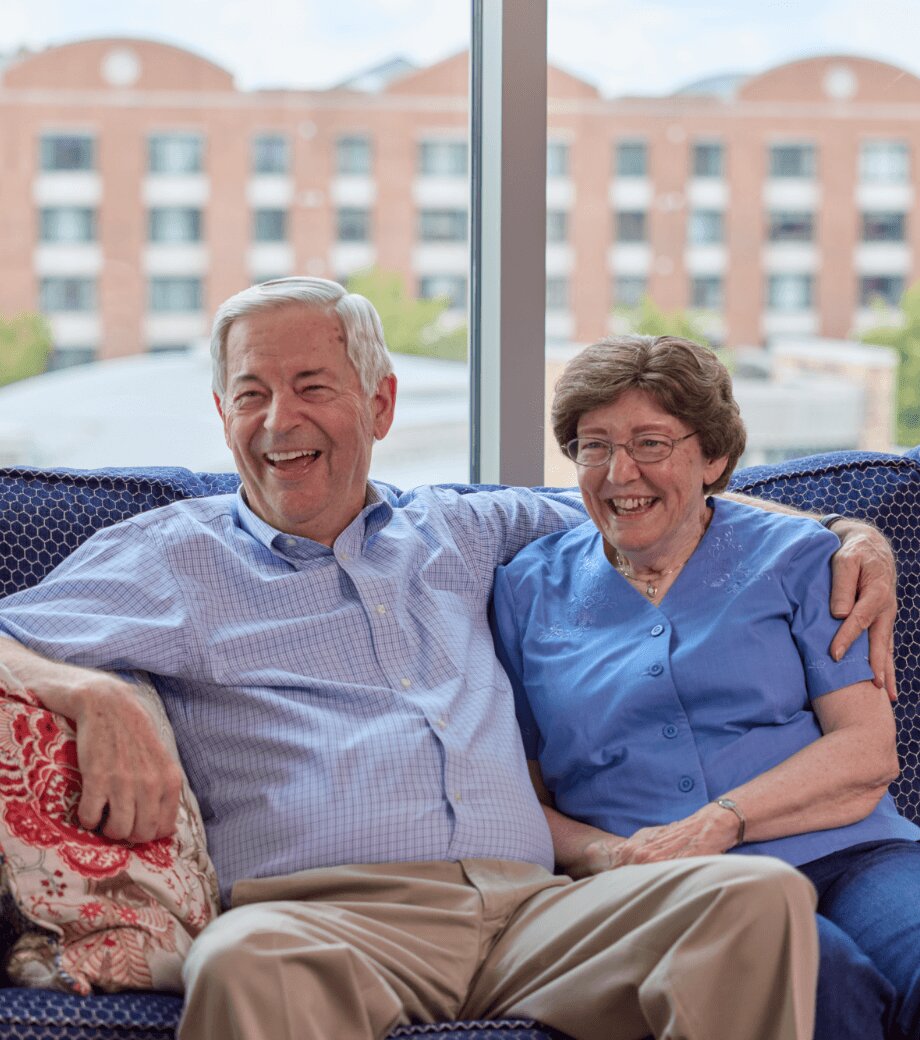 Senior couple lounging on couch