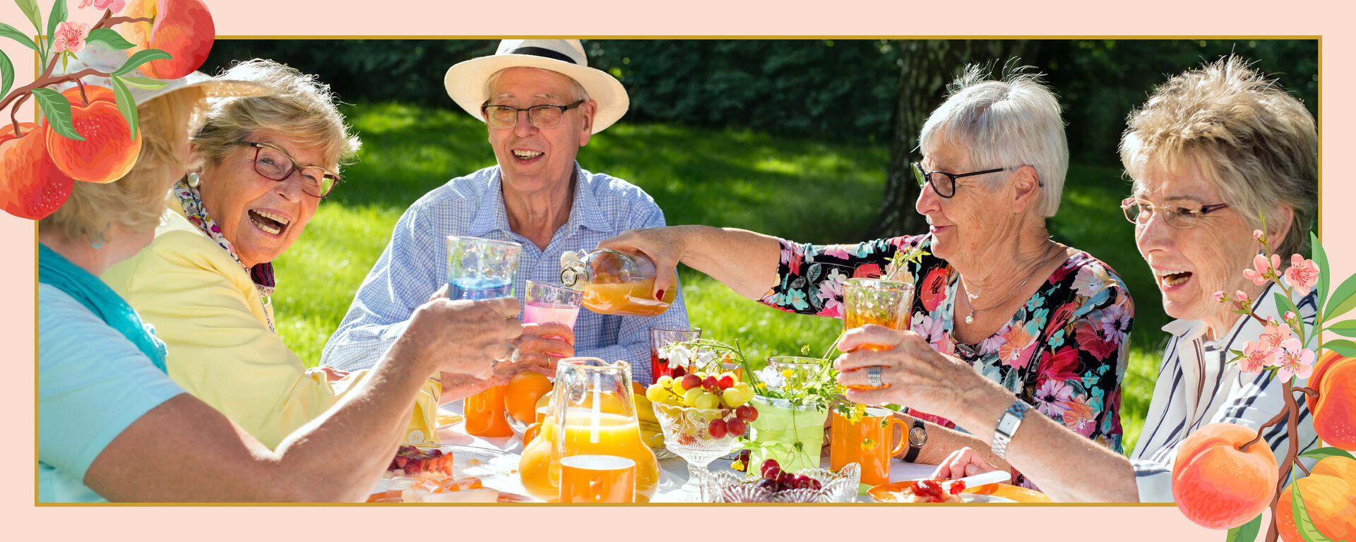 Senior friends cheers cocktails outdoors
