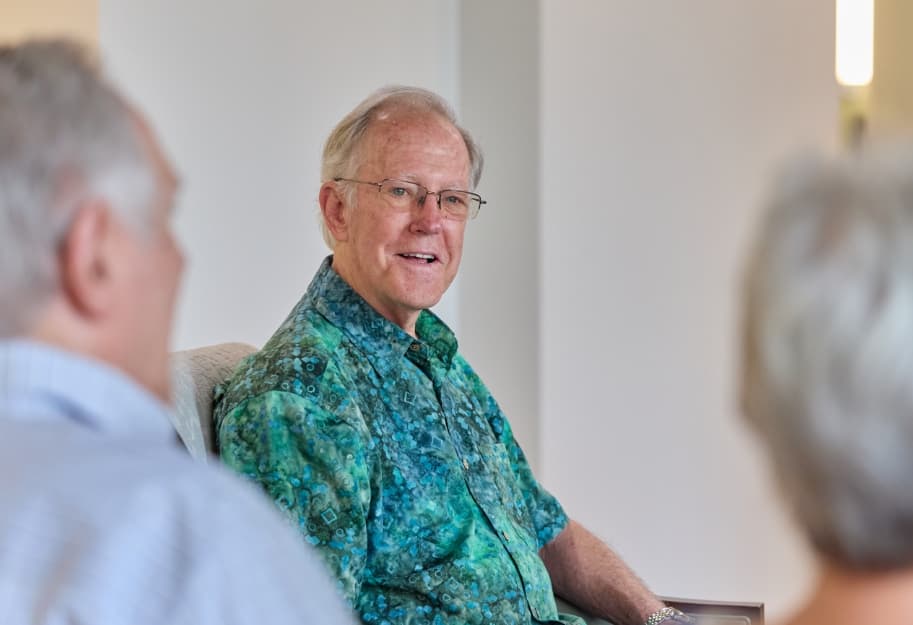 Senior friends sitting together