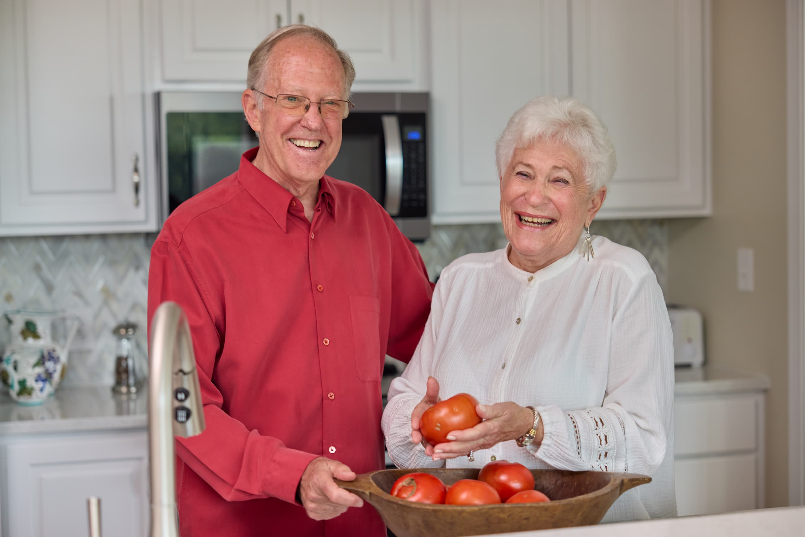 Marquette senior couple smiling in kitchen