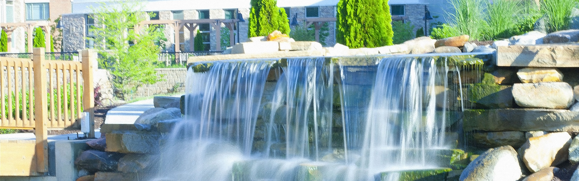 waterfall over rock garden in courtyard