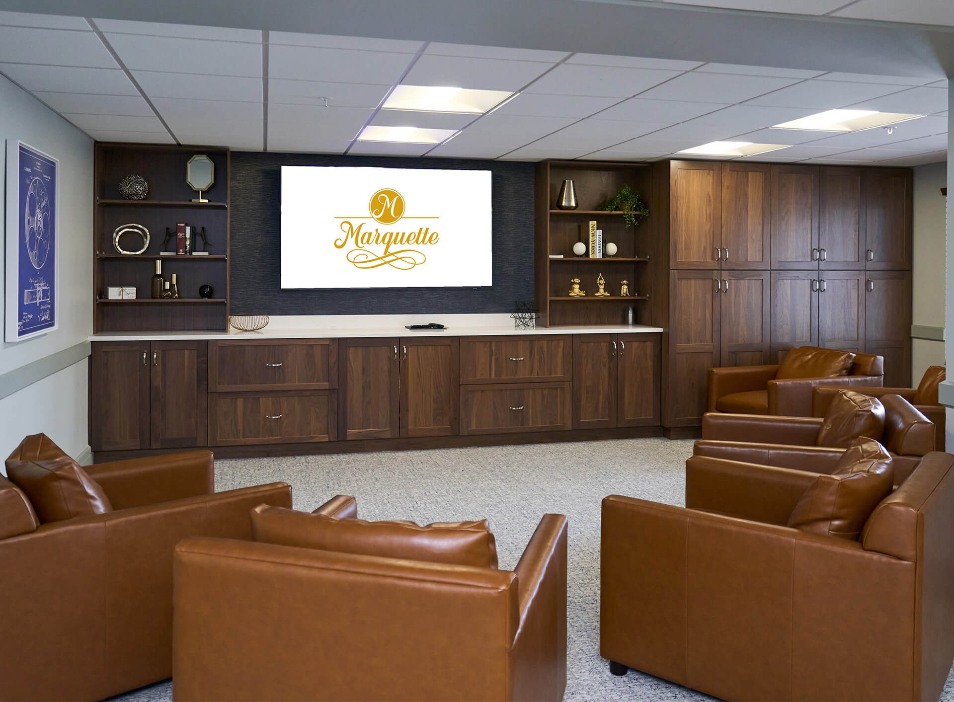 Comfortable lounge area with leather chairs and wooden cabinets.