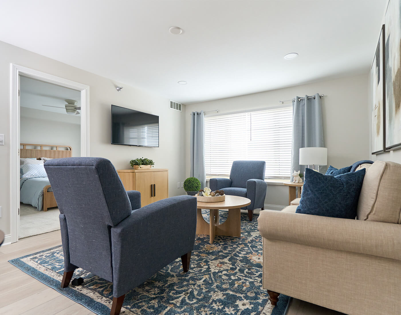 Bright living area in a senior community unit with modern furniture.